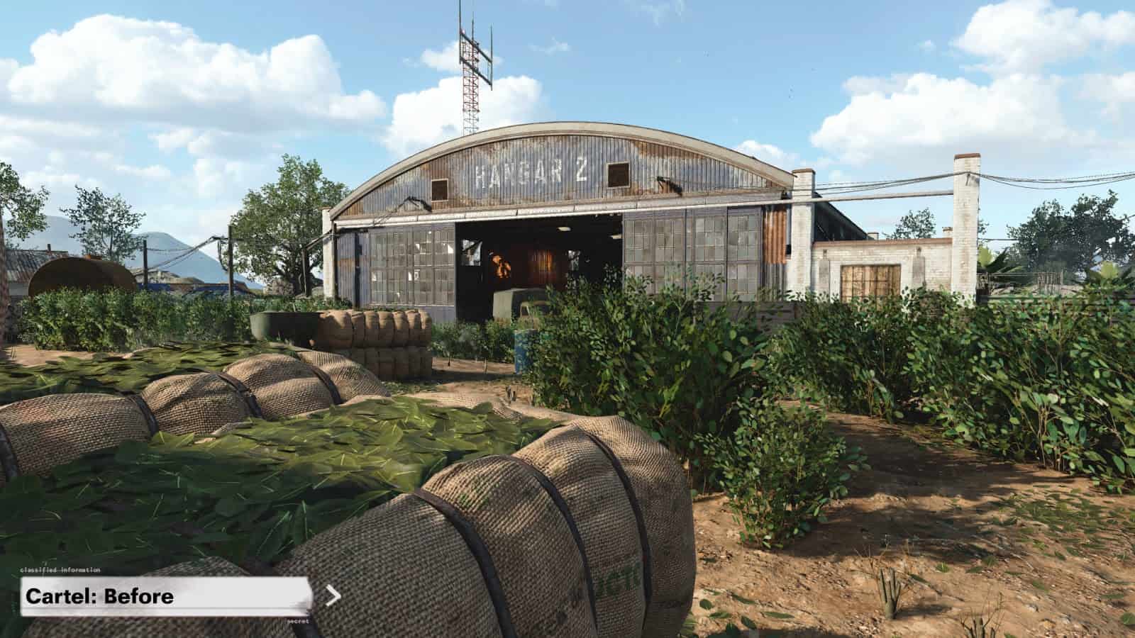 A screenshot from Call of Duty Black Ops Cold War map Cartel before the map changes. Tall shrubbery lines out paths on the way to a large airplane hanger.