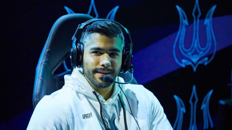 Bryan "Apathy" Zhelyazkov faces the camera in his gaming chair wearing a white hoodie