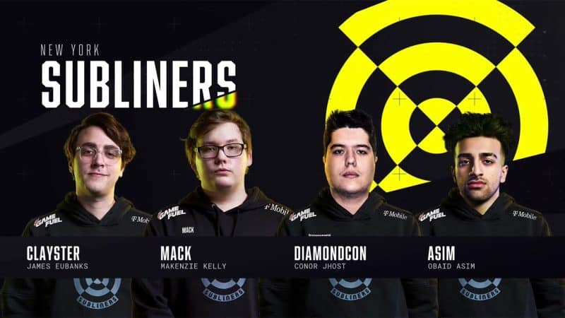 The roster for the New York Subliners stand in front of their team logo, the viewfinder of a submarine scope in yellow and black