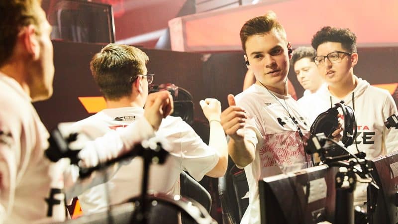 The roster of Atlanta FaZe congratulate each other after a game