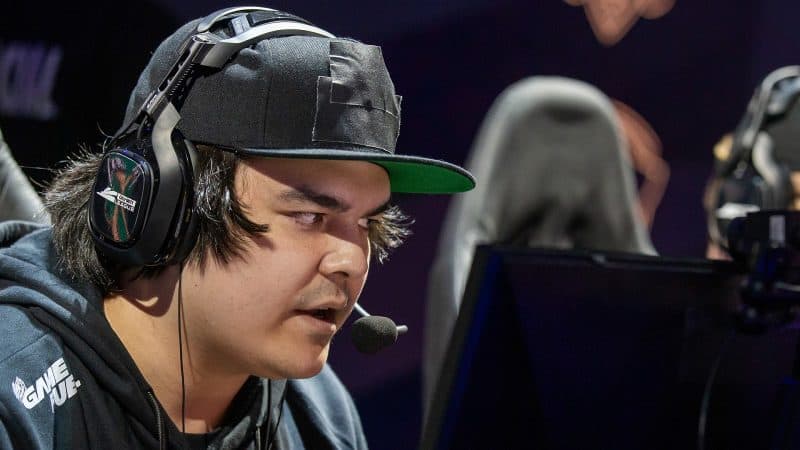 Pro Call of Duty player for OpTic Chicago Matthew "FormaL" Piper looks seriously at a PC monitor and talks to his team through a headset during a CDL match.