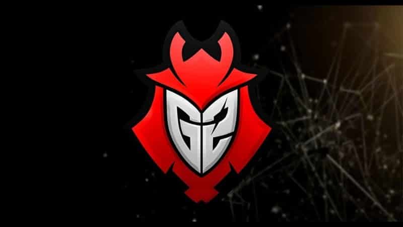 The logo for esports team G2, featuring a stylized silver letter G and Number 2 set inside a red samurai helmet