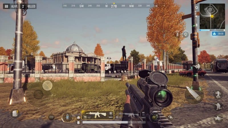 A screenshot from PUBG New State, showing a FPS view of a player holding a scoped rifle standing in front of a building with a wall in front of it and the player's HUD.