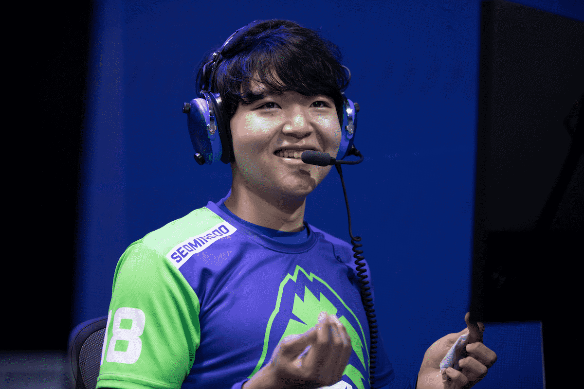 Pro Overwatch League player Min-soo "SeoMinSoo" Seo smiles with a headset and Vancouver Titans jersey on.