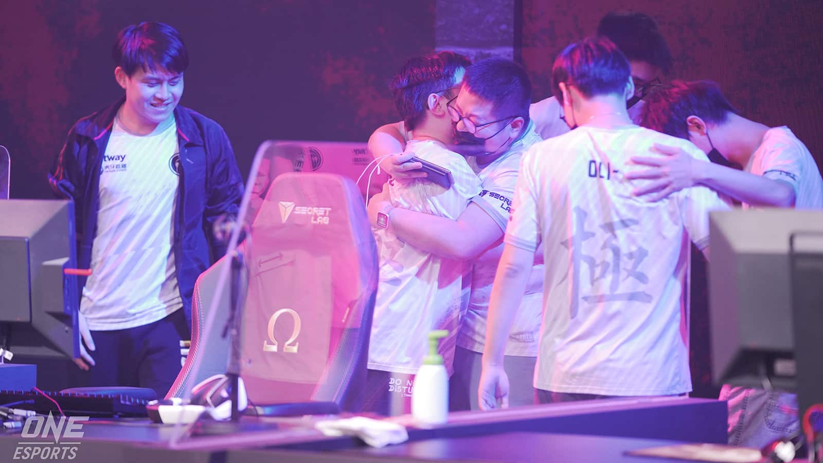 Grand Finals Champions, Invictus Gaming, celebrate with hugs all round after winning the ONE Esports Dota 2 Singapore Major