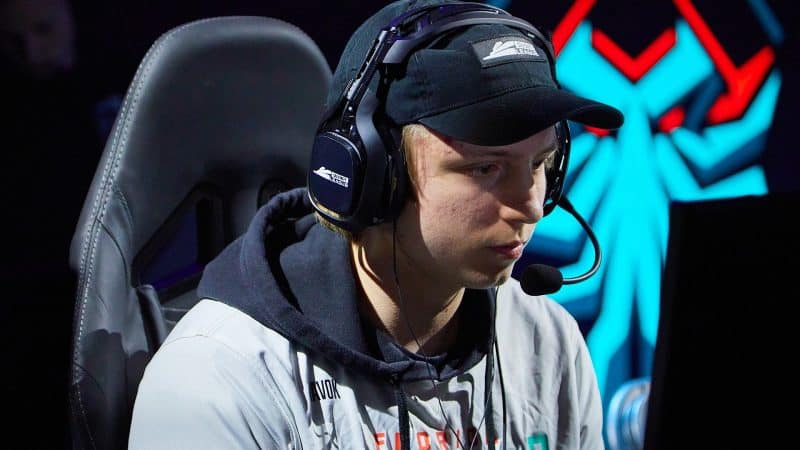 Pro Call of Duty League player Colt “Havok” McLendon sits at a PC with a Florida Mutineers logo behind him.