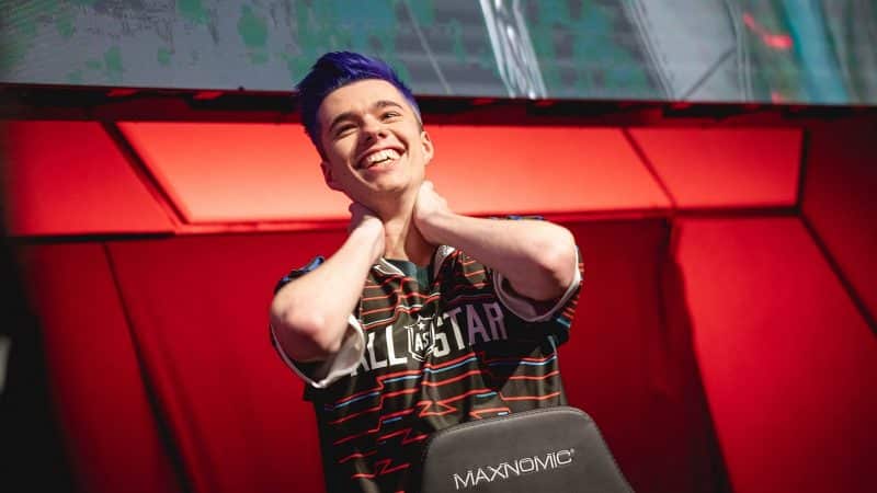 UOL Kirill “AHaHaCiK” Skvortsov holds his hands on the back on his neck and smiles at All-Stars.