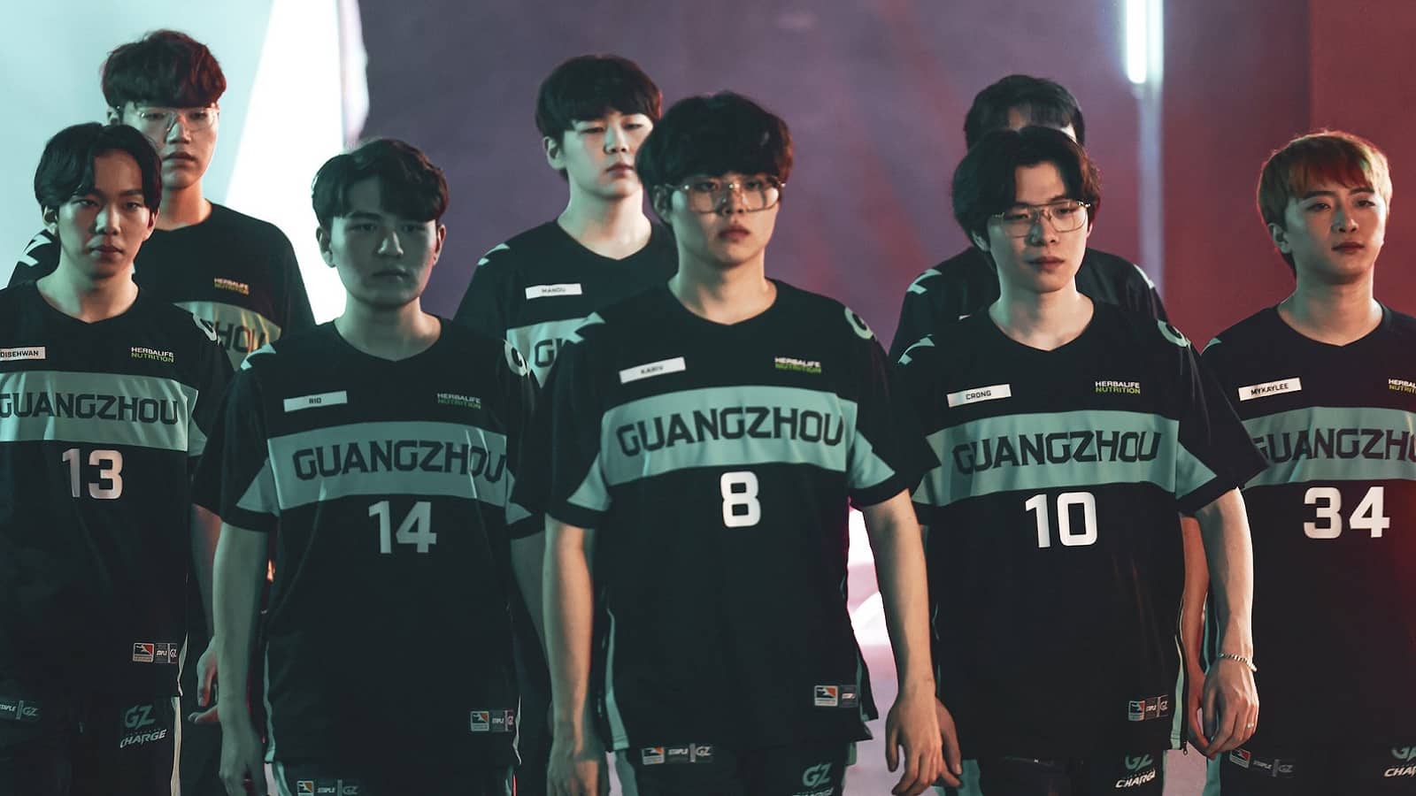 The Guangzhou Charge roster walks out onto a stage together.
