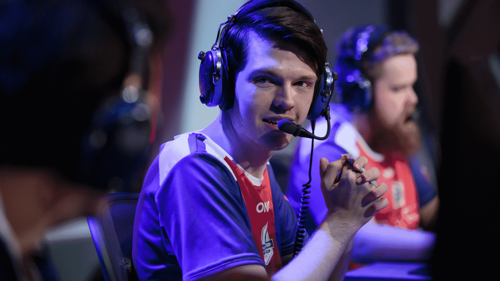 Pro Overwatch League player Stefan "Onigod" Fiskerstrand talks to his teammates on the OWL stage.