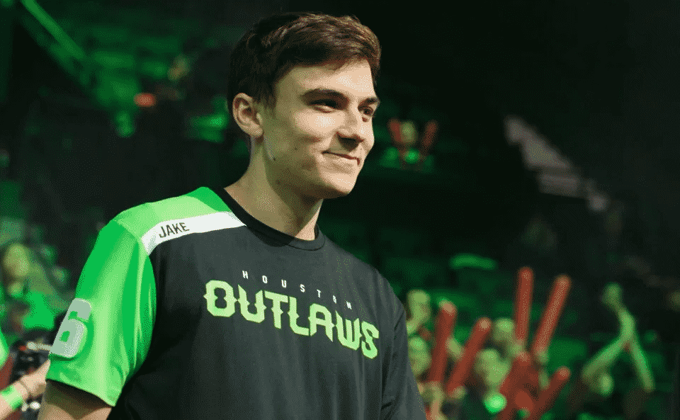 Jacob "JAKE" Lyon stands on stage in his Houston Outlaws jersey