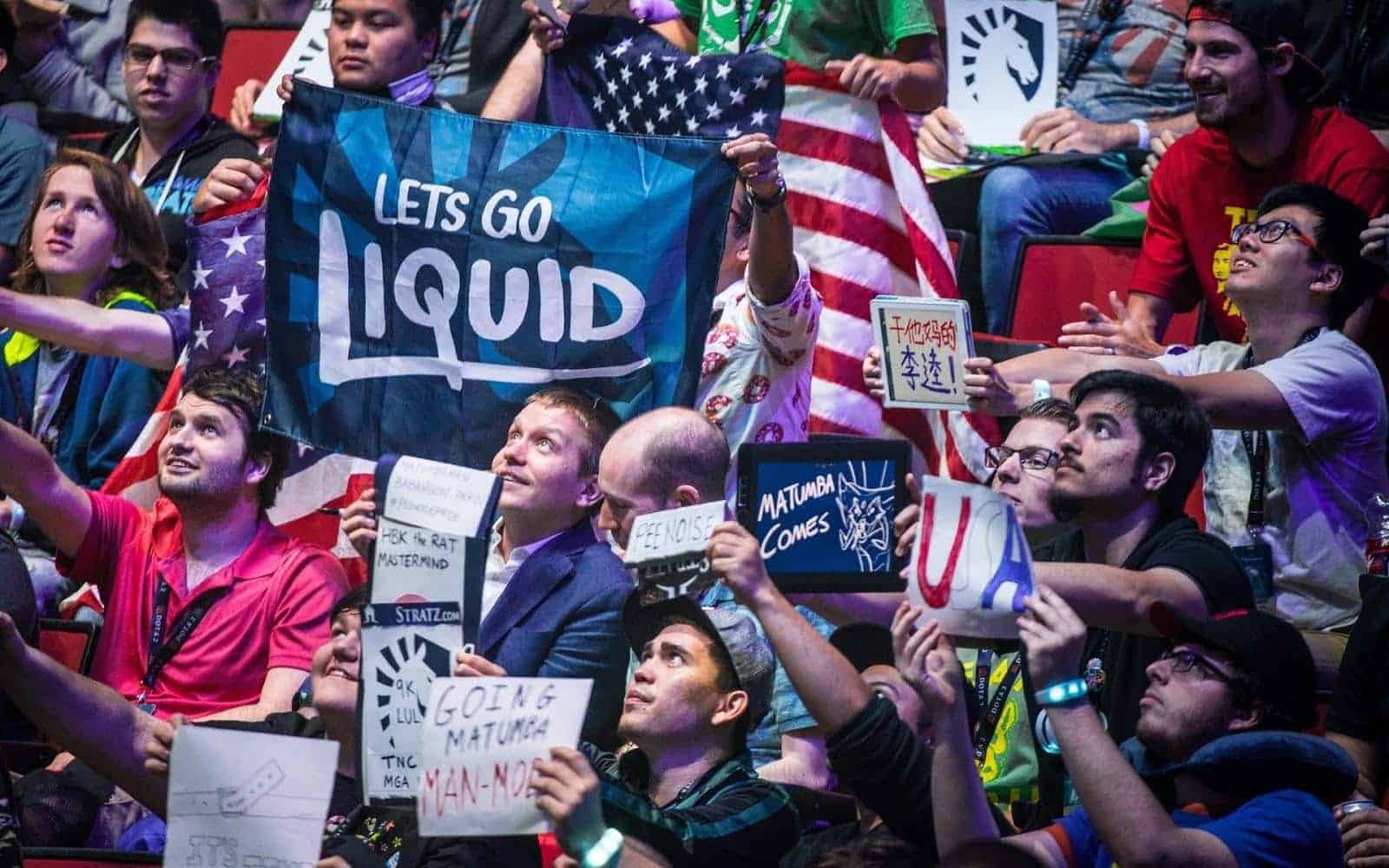 Team Liquid fans holding a team flag
