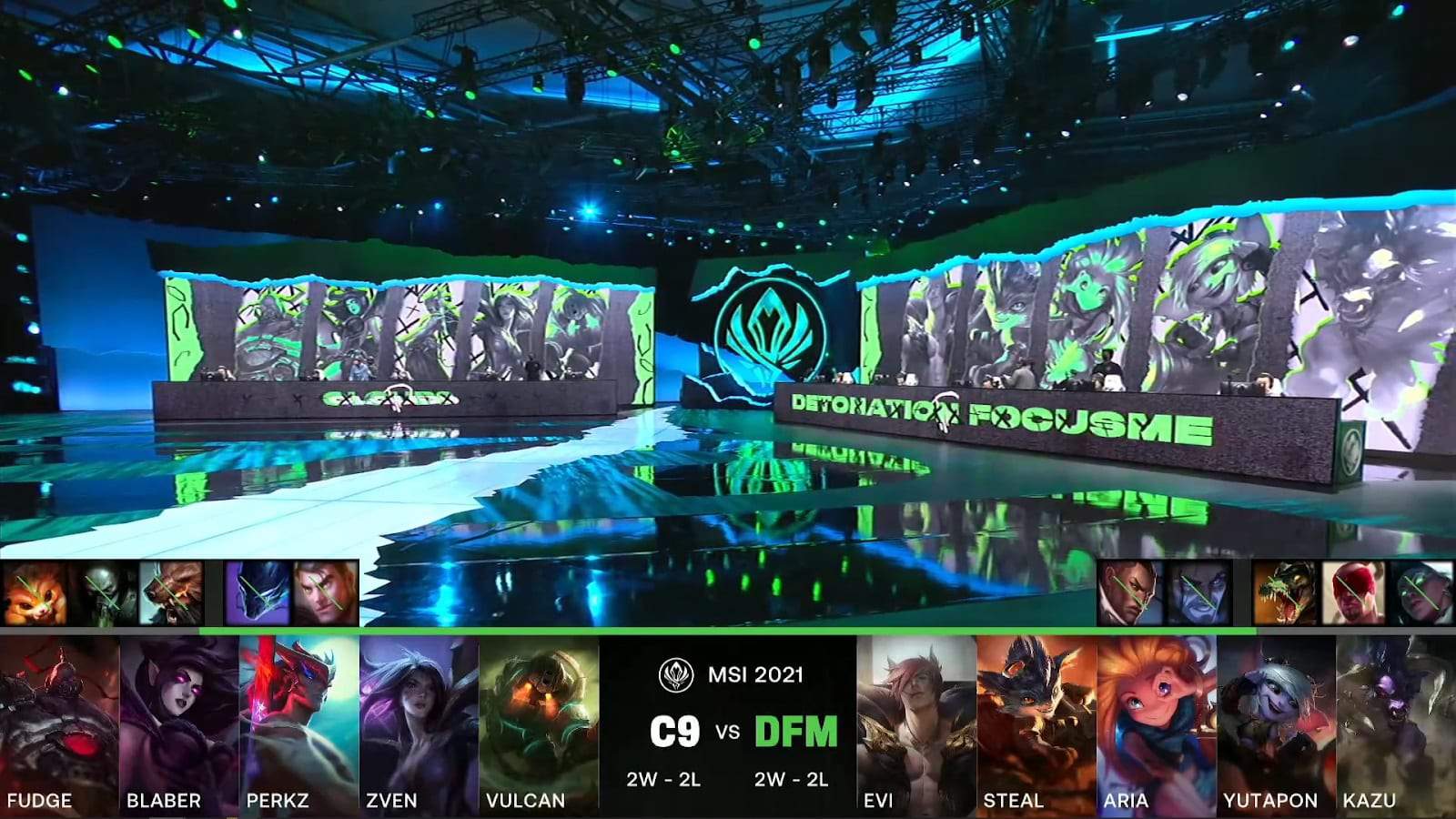 A screenshot from the LoL Esports broadcast for the Mid-Season Invitational (MSI) match between DetonatioN FocusMe and Cloud9. The picked and banned champion drafts appear at the bottom of the image with a shot of the 2021 MSI stage above.