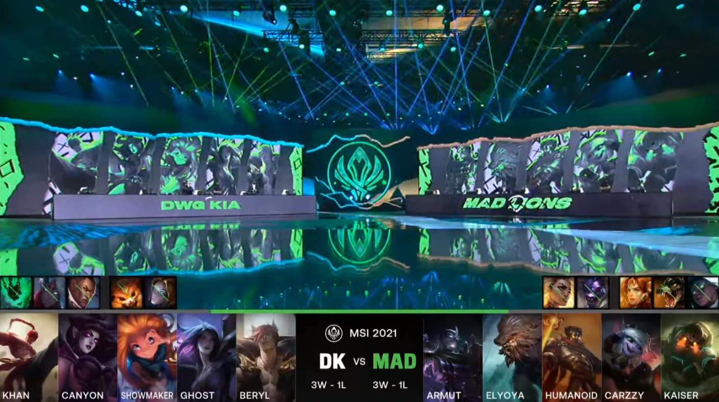 A screenshot from the LoL Esports broadcast for the Mid-Season Invitational (MSI) match between DAMWON KIA and MAD Lions. The picked and banned champion drafts appear at the bottom of the image with a shot of the 2021 MSI Stage above.