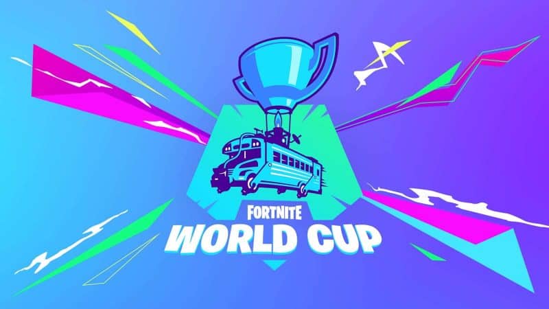 The Fortnite battle bus is shown with a trophy on top of it as the Fortnite World Cup logo.