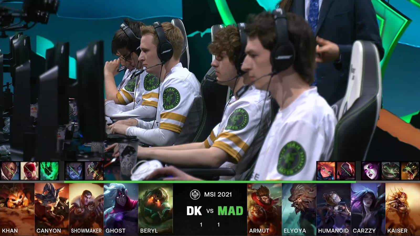 A screenshot from the LoL Esports broadcast for the Mid-Season Invitational (MSI) Semifinal match between MAD Lions and DAMWON KIA. The picked and banned champion drafts appear at the bottom of the image with a shot of the MAD Lions lineup on stage above.