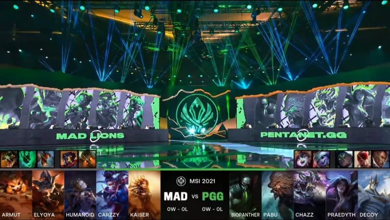 A screenshot from the LoL Esports broadcast for the Mid-Season Invitational (MSI) match between MAD Lions and Pentanet.GG . The picked and banned champion drafts appear at the bottom of the image with a shot of the 2021 MSI stage above.