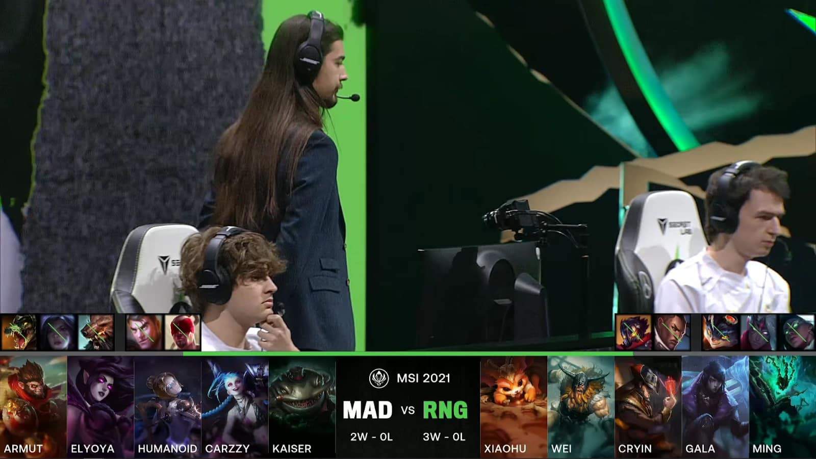 A screenshot from the LoL Esports broadcast for the Mid-Season Invitational (MSI) match between MAD Lions and Royal Never Give Up (RNG). The picked and banned champion drafts appear at the bottom of the image with a shot of the MAD players and coach above.