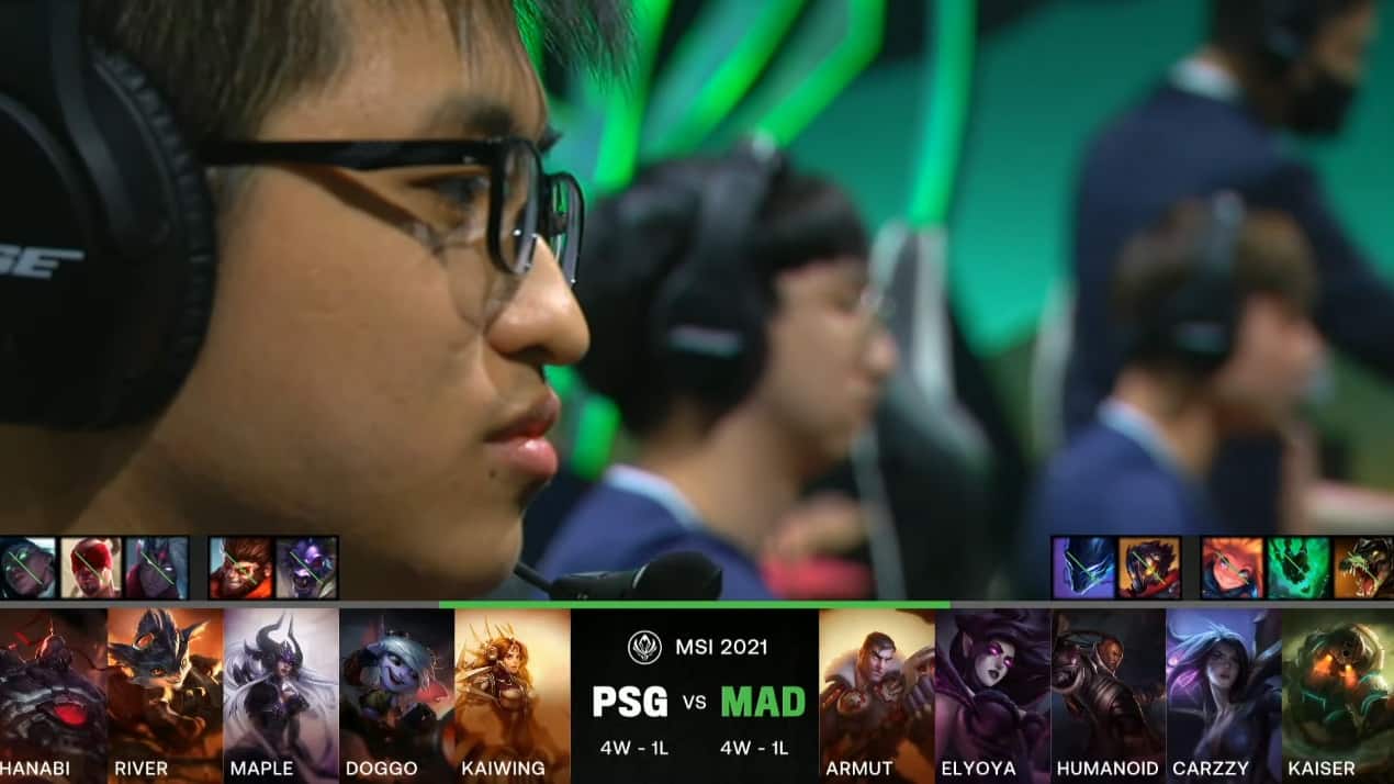 A screenshot from the LoL Esports broadcast for the Mid-Season Invitational (MSI) match between PSG.Talon and MAD Lions. The picked and banned champion drafts appear at the bottom of the image with a shot of the the PSG lineup on stage above.