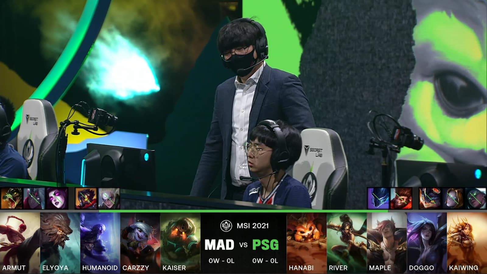 A screenshot from the LoL Esports broadcast for the Mid-Season Invitational (MSI) match between PSG.Talon and MAD Lions. The picked and banned champion drafts appear at the bottom of the image with a shot of the PSG.Talon coach and players on stage above.