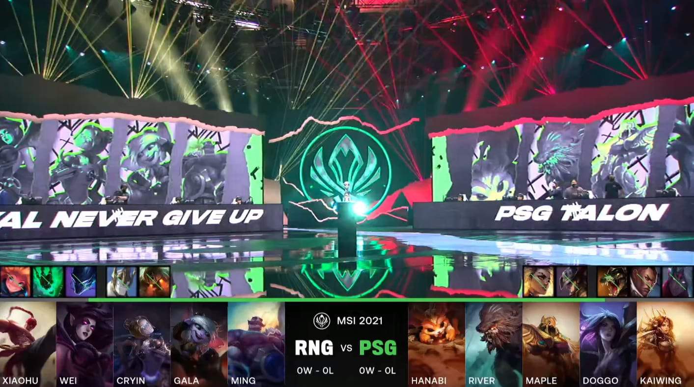 A screenshot from the LoL Esports broadcast for the Mid-Season Invitational (MSI) Semifinal match between Royal Never Give Up (RNG) and PSG.Talon. The picked and banned champion drafts appear at the bottom of the image with a shot of the 2021 MSI stage above.