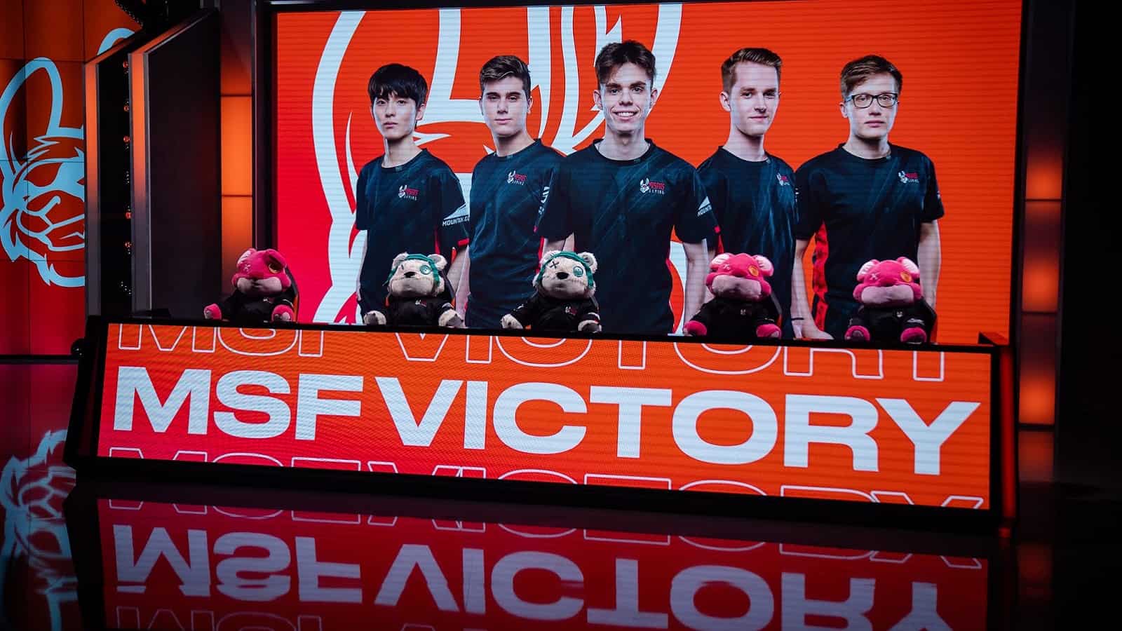 A shot of the LEC stage with the words "MSF Victory" on one large monitor with another showing the players of the Misfits LoL roster.