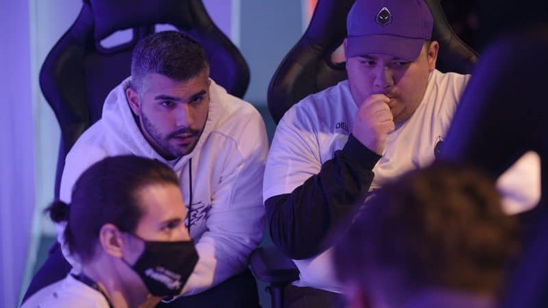 Members of the LA Guerrillas, Martin "Cheen" Chino and Bryan "Apathy" Zhelyazkov lean forward in their seats during a team discussion