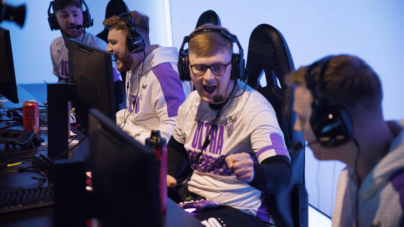 The roster for the Toronto Ultra congratulate each other with fist bumps and high fives after winning a match