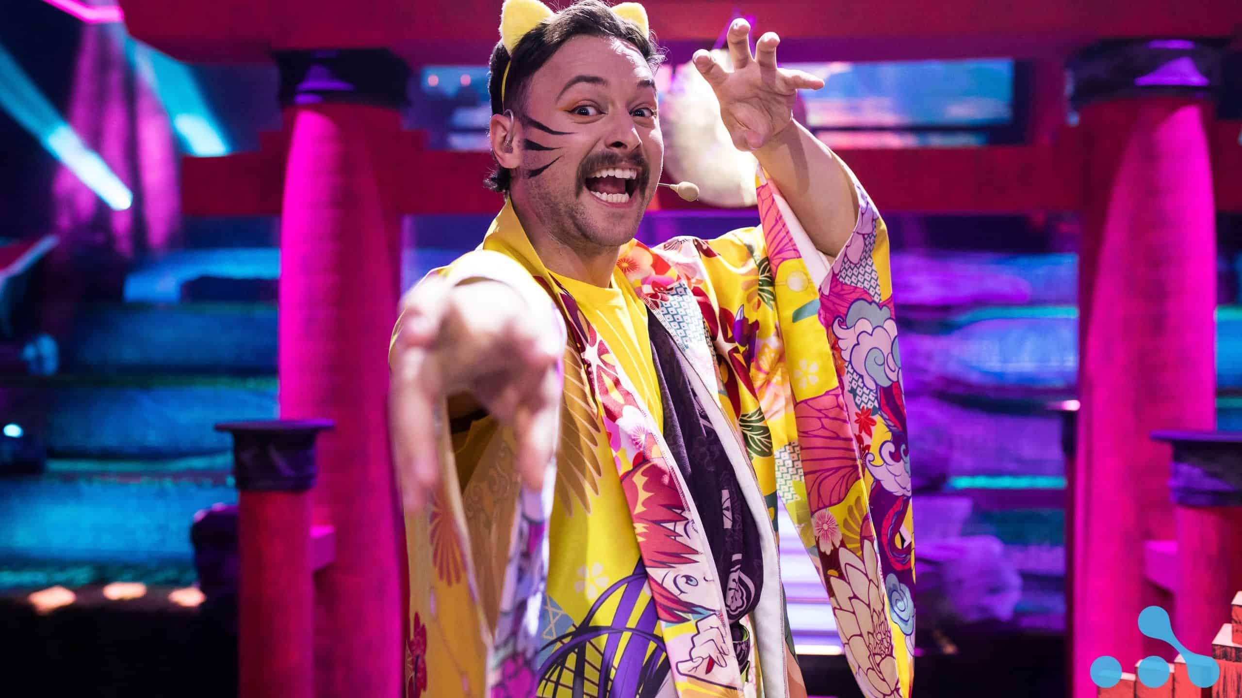 AniMajor desk host Richard "Rich" Campbell poses, ninja-style, in his yellow kimono and cat ears