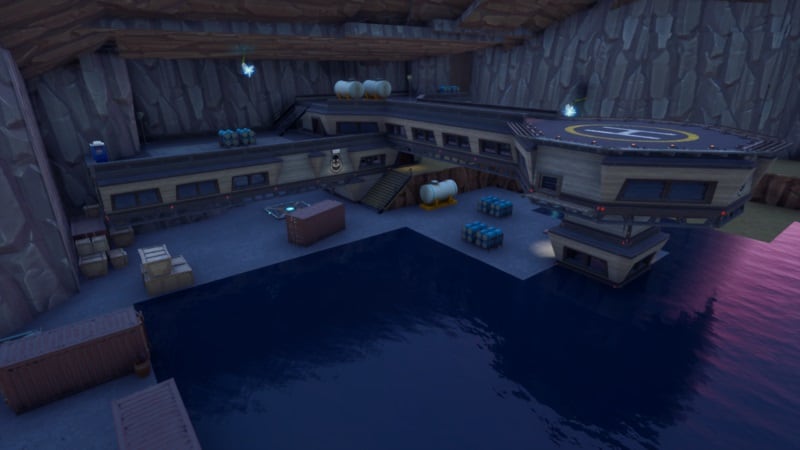 A screenshot of the Grotto location from Fortnite, a facility in a cave near the water.
