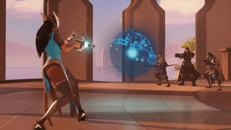 The hero Symmetra fires her photon projector at a group of incoming adversaries