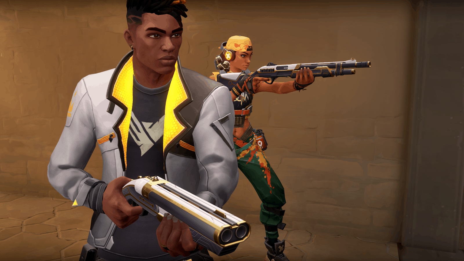 Valorant agents Phoenix and Raze skulk along the side of a building with weapons drawn