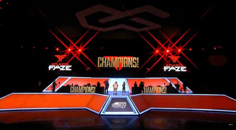 The stage lit up with the Atlanta FaZe colors and the word "Champions" displayed on the big screen after the team's recent victory