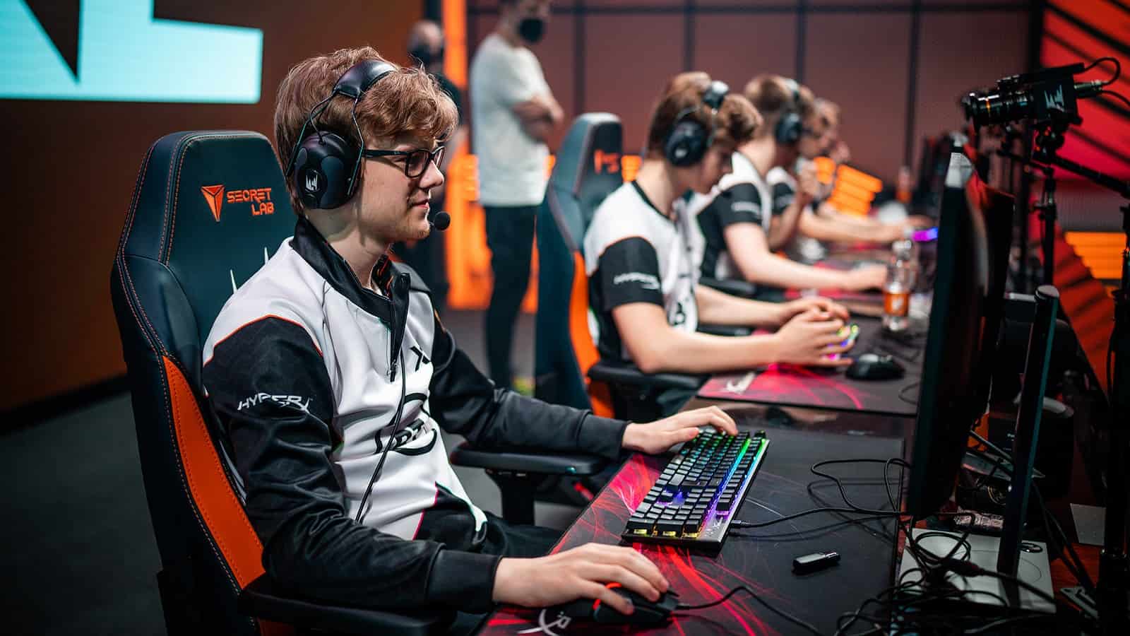 Felix "Kryze" Hellström and the rest of the Excel Esports LEC roster plays a LoL match on stage.