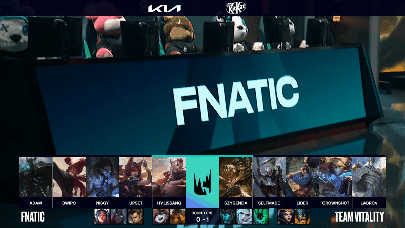 A screenshot from the LEC broadcast for the Summer Playoffs match between Fnatic and Vitality. The Game Two drafts appear on screen with a shot of a monitor with the team name Fnatic and some LoL plushies above.