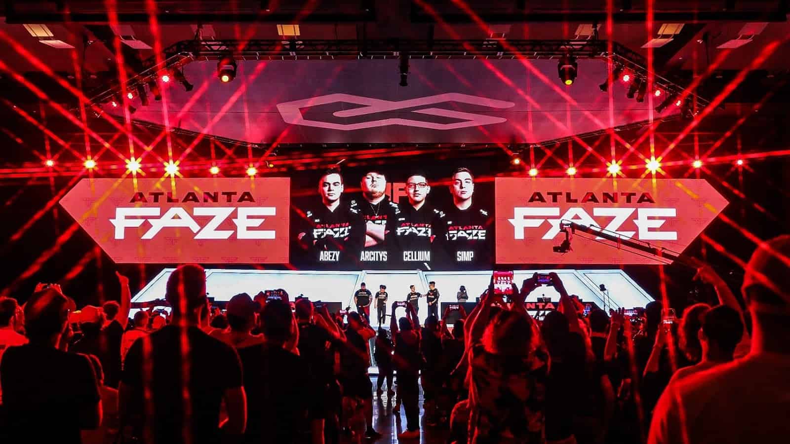 The Call of Duty League Stage 5 Major stage is lit up in a myriad of red lights with the Atlanta FaZe logo and team on monitors.