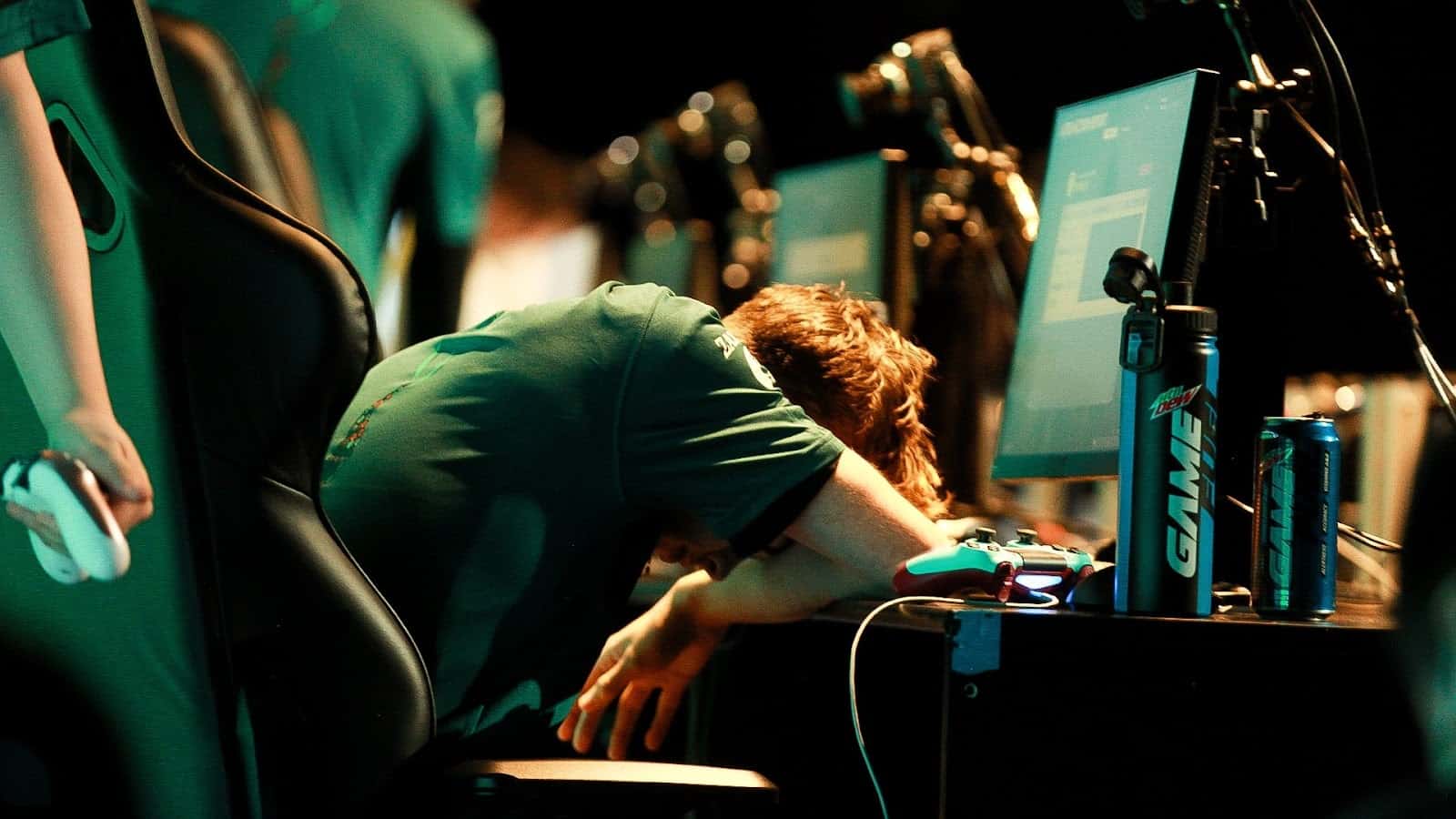 Travis "Neptune" McCloud slumps over in front of a line of computers after a devastating loss at the CDL Stage 5 Major.