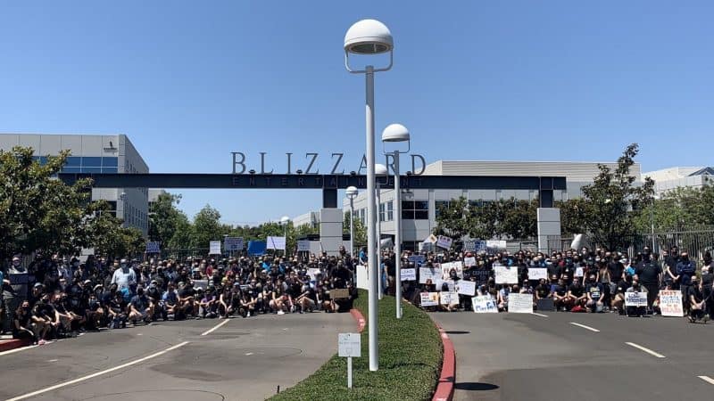 A photo taken from the Blizzard Walk Out demonstration of 2021, showing a host of workers and activists grouped together with signs at the Blizzard headquarters.