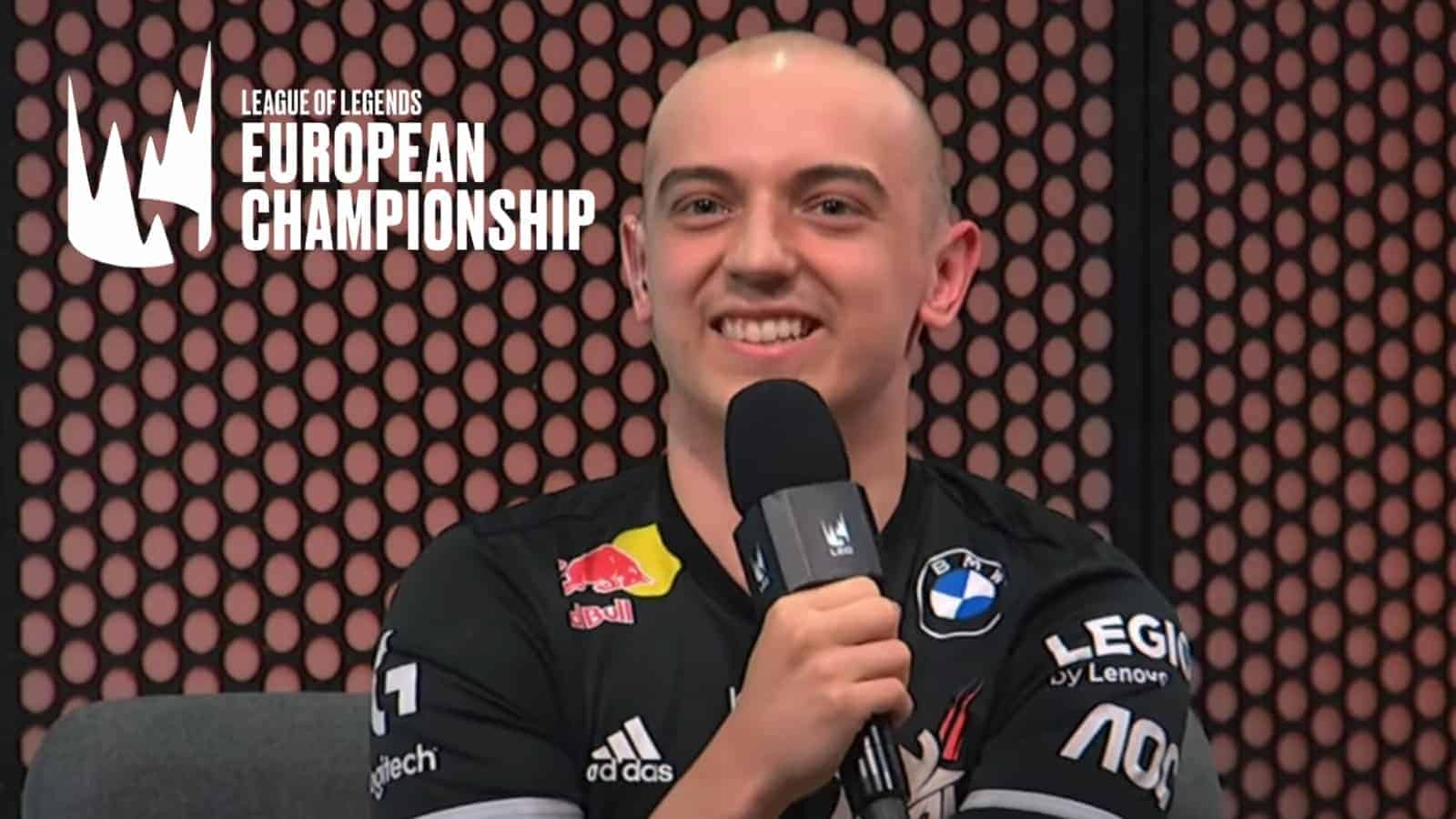 G2 Esports' Rasmus "Caps" Borregaard Winther smiles during an LEC interview with the LEC logo next to him.