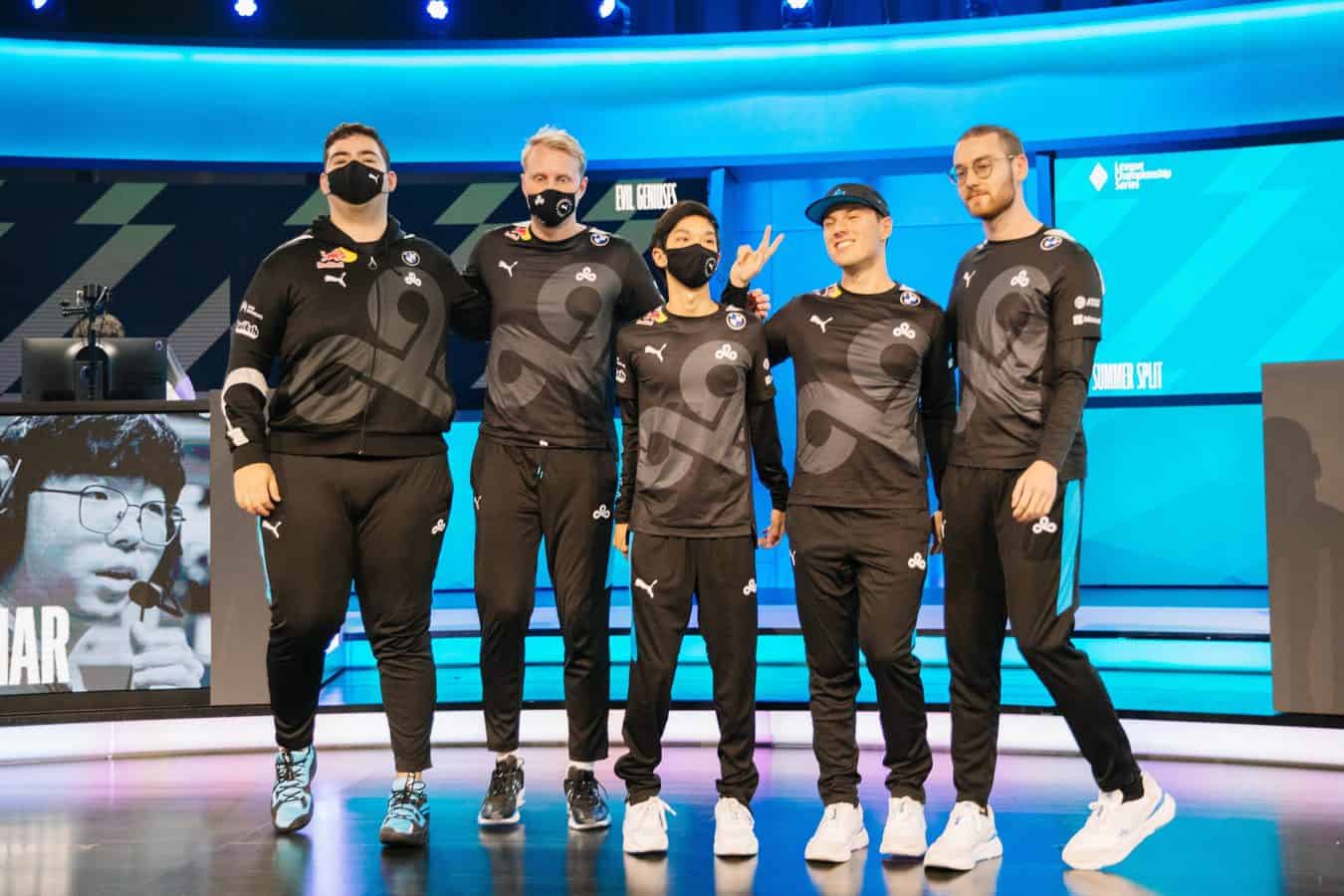 The Cloud9 LoL roster of Fudge, Zven, Blaber, Pekz and Vulcan pose together on the LCS stage.