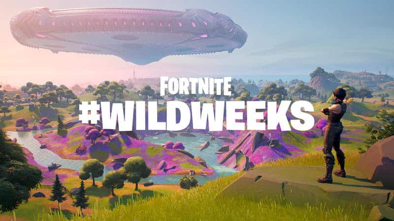 The words "Fortnite #WildWeeks" appears over an image of a female Fortnite character looking over a forest with an alien ship hovering above.