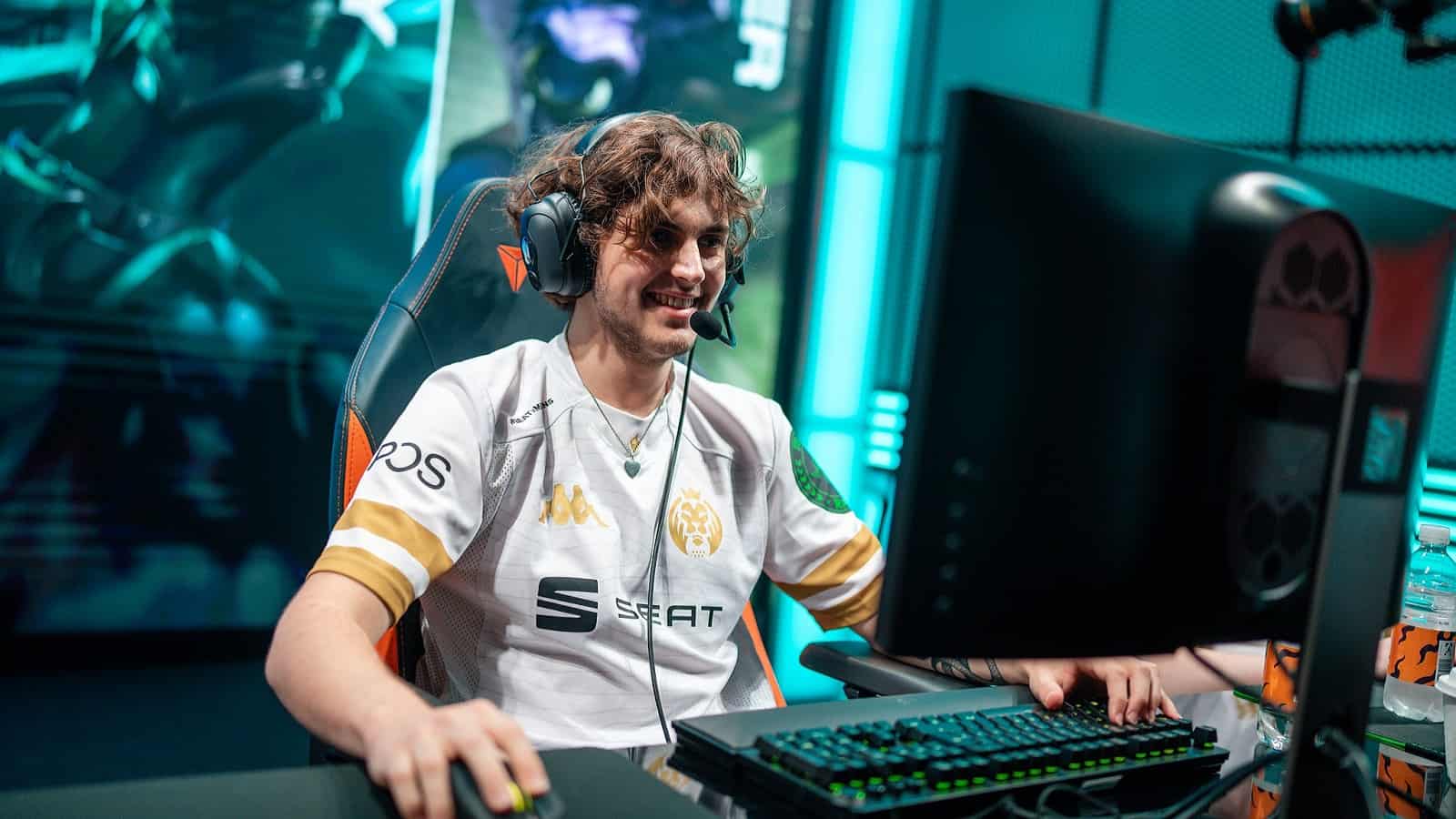 MAD Lions' ADC player Carzzy smiles during a match on the LEC stage.