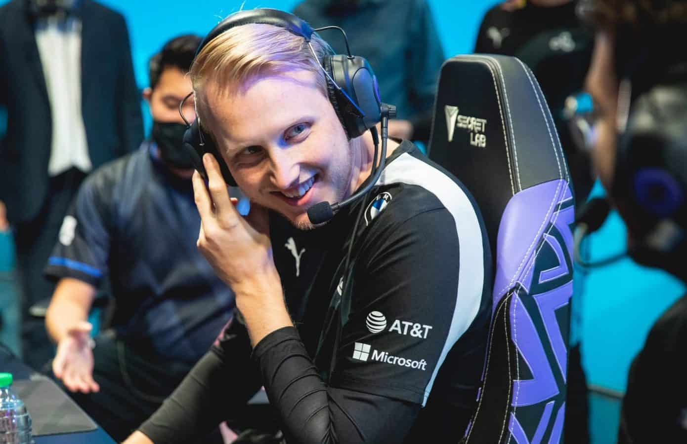 Pro LoL player for Cloud9 Jesper "Zven" Svenningsen smiles towards a teammate on the LCS stage.