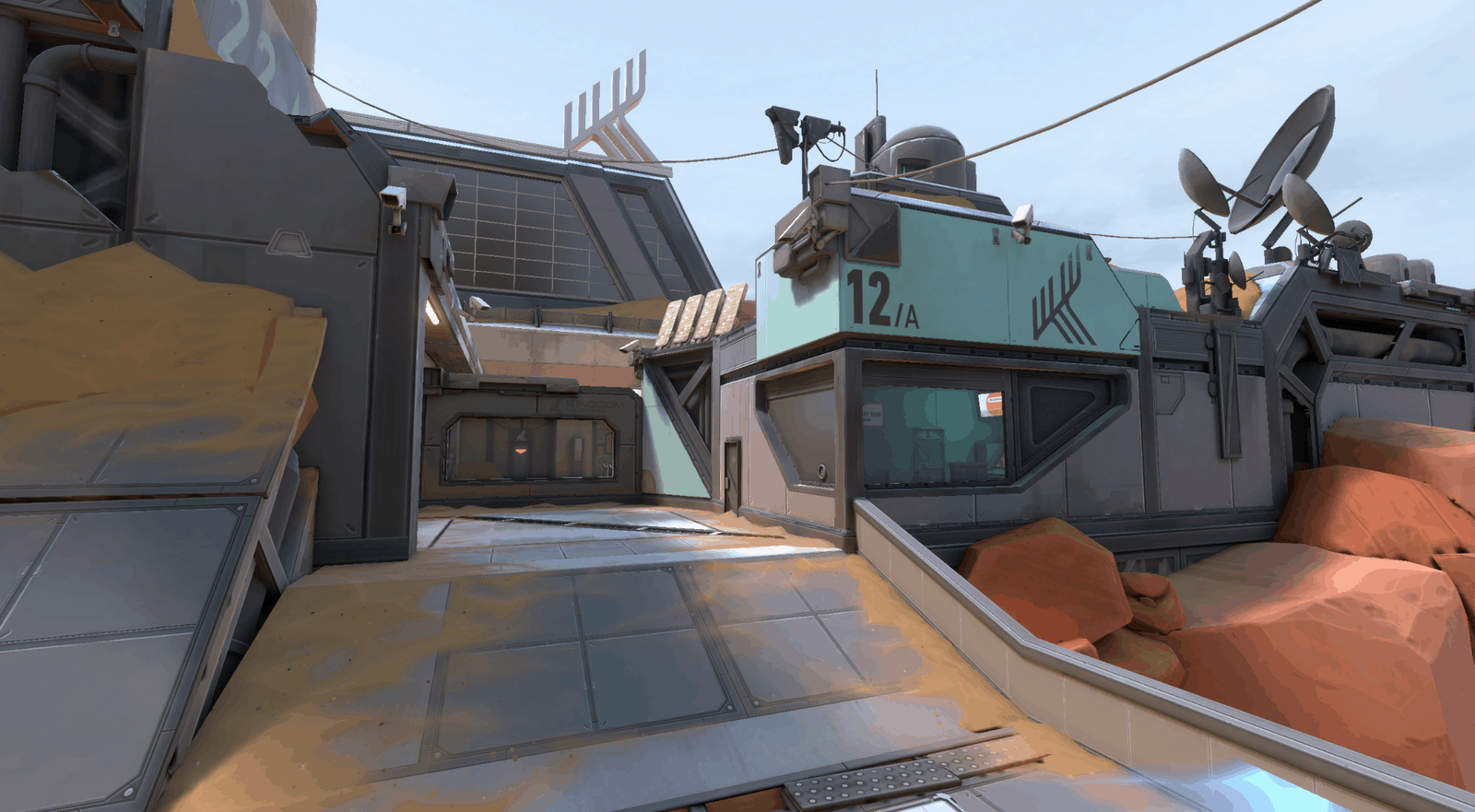 A screenshot of the new Fracture map in Valorant, showing a piece of the desert biome half of the futuristic facility.