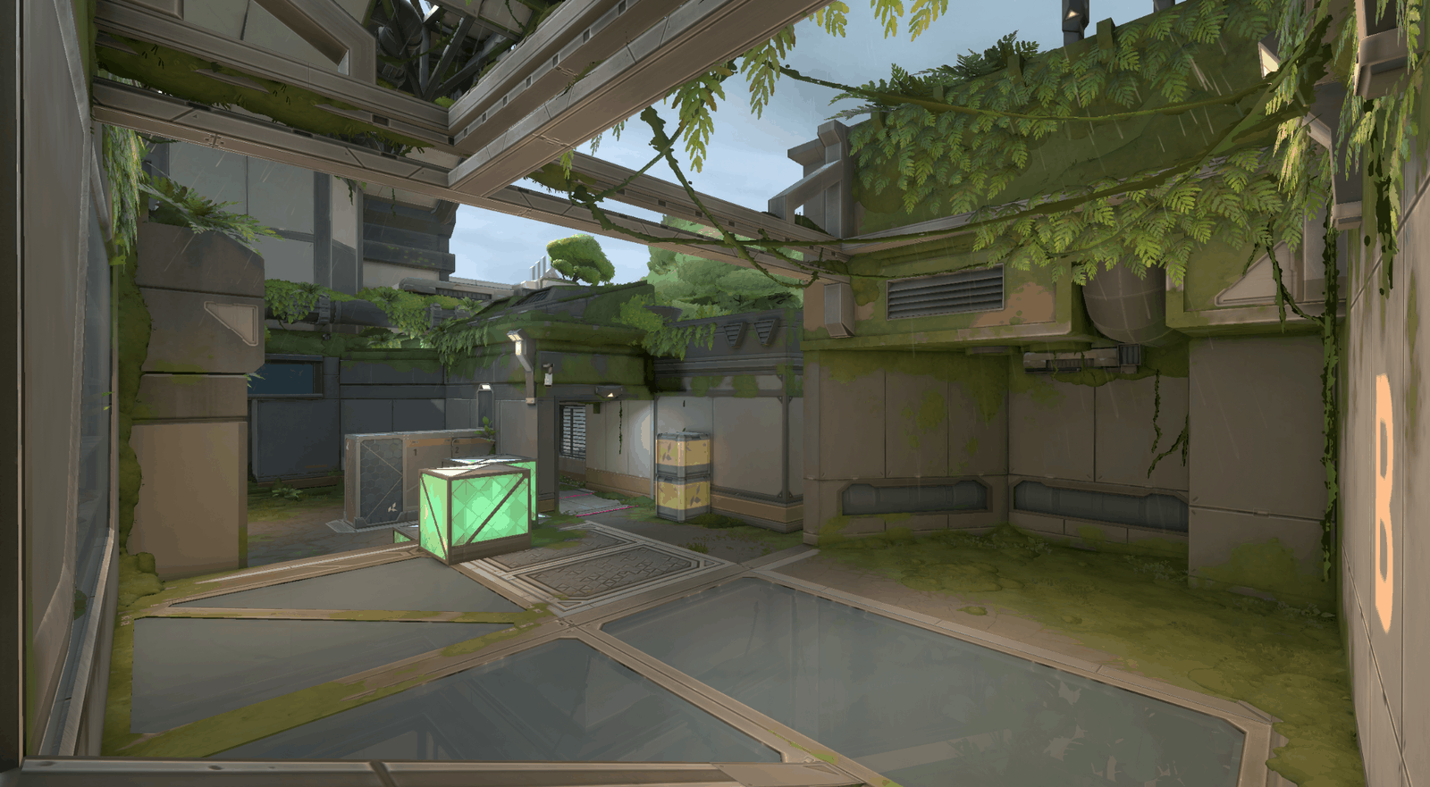 A screenshot of the new Valorant map Fracture, showing the jungle biome half with greenery growing throughout the facility.