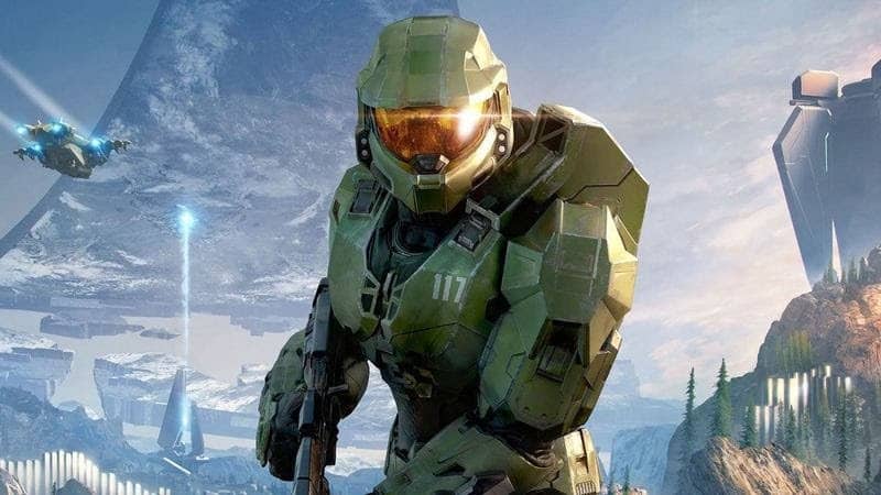 Halo protagonist Master Chief holds an assault rifle.