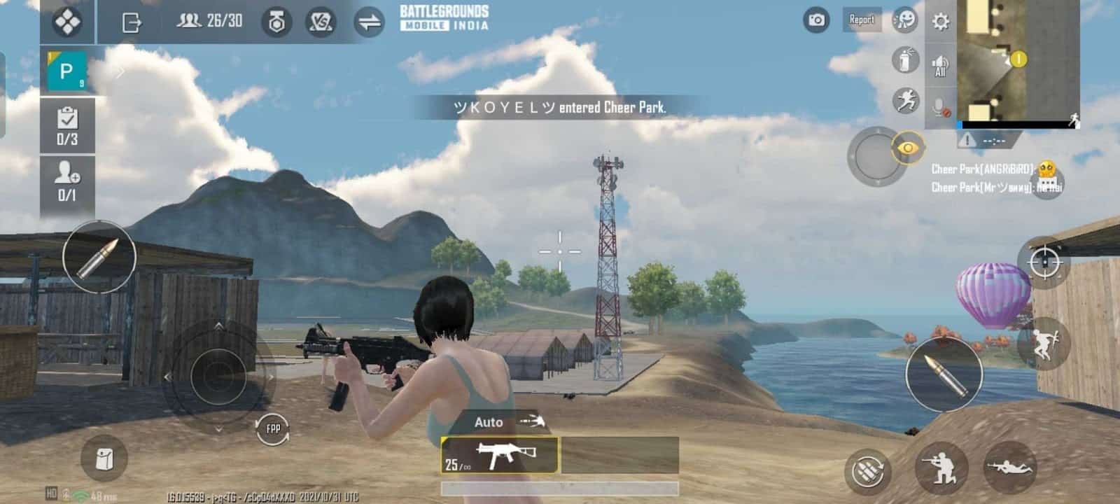 A female character from Battlegrounds Mobile India walks near a shed under a blue sky holding an SMG.