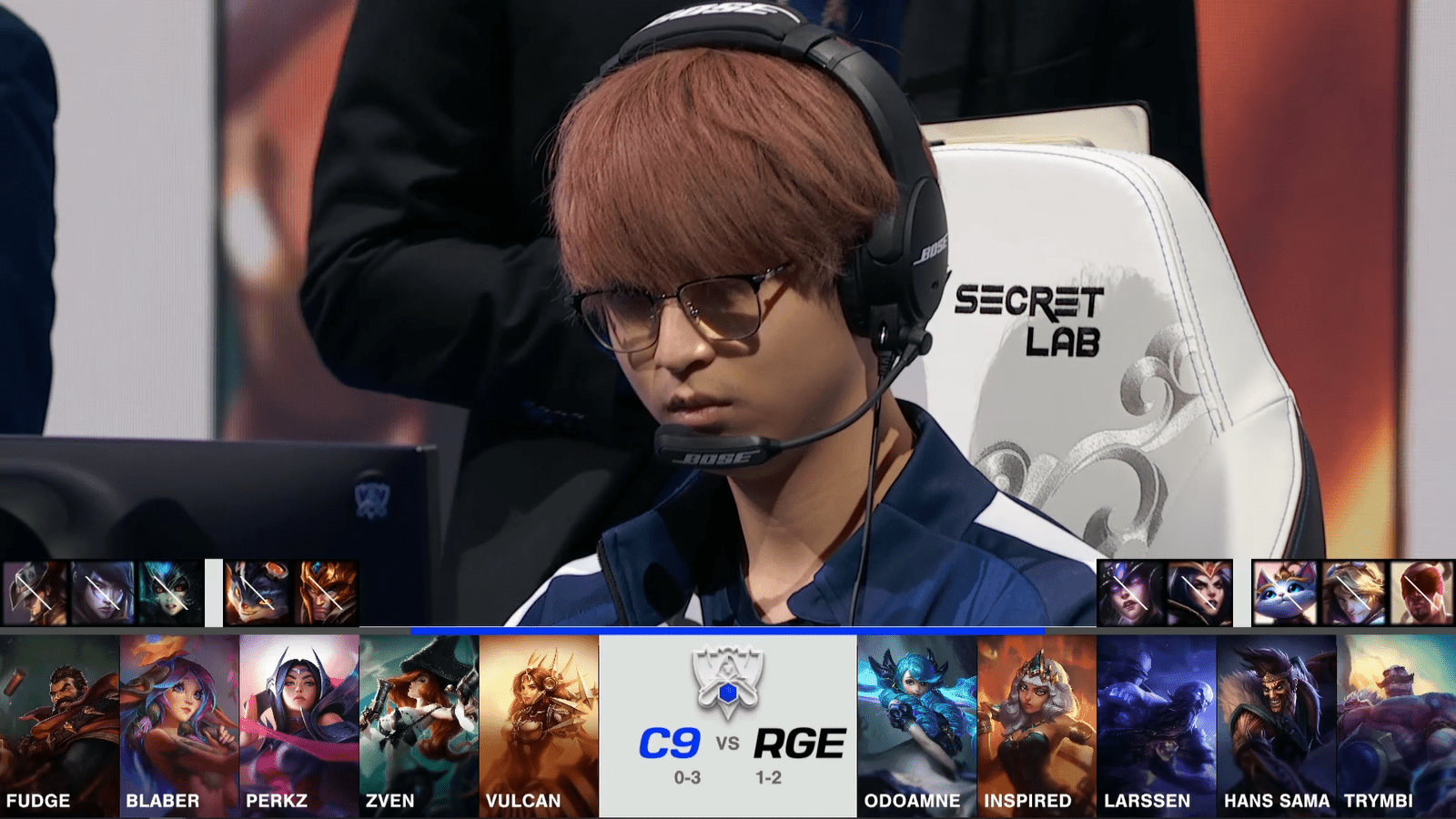 A screenshot from the 2021 World Championship Main Event Group Stage broadcast, showing the champion drafts between Cloud9 and Rogue with a shot of Rogue ADC Hans Sama above.