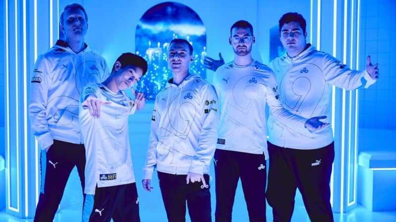 The Cloud9 LoL roster of Fudge, Blaber, Perkz, Zven and Vulcan all pose in different ways together at the World Championship.