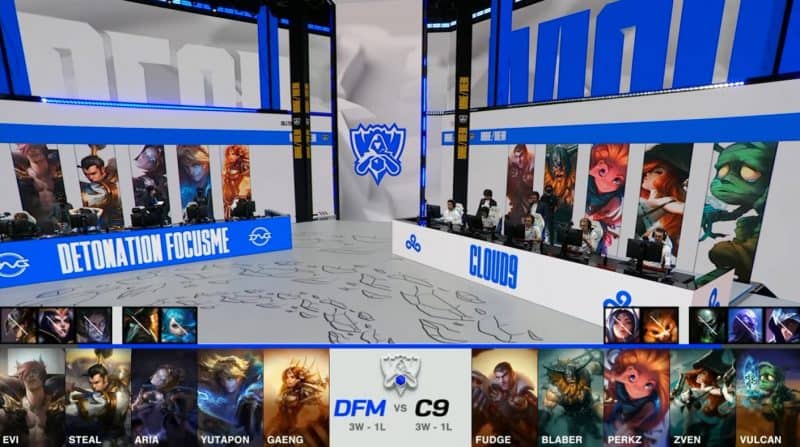 A screenshot from the 2021 World Championship Play-ins broadcast, showing the drafts between DetonatioN FocusMe and Cloud9 with a shot of DFM and C9 on the Worlds 2021 stage in the middle.