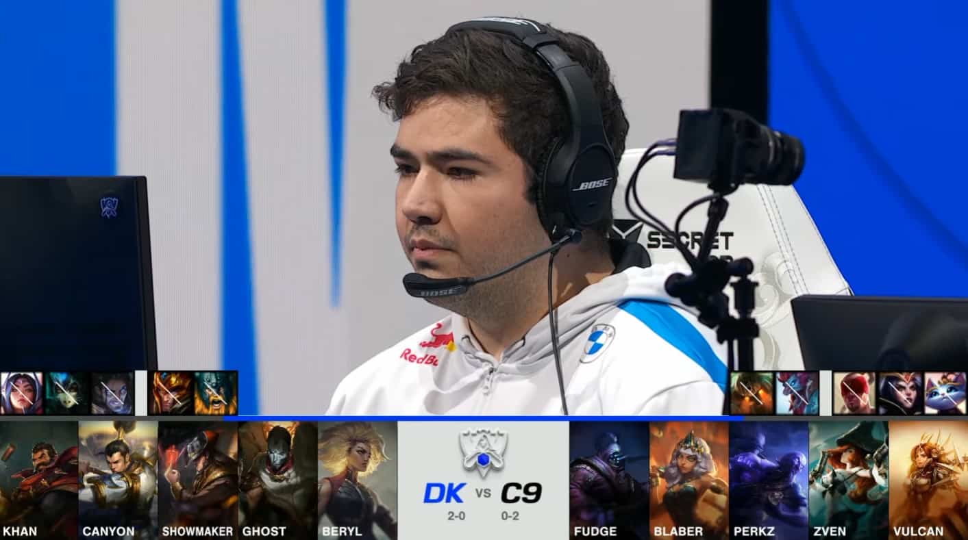 A screenshot from the 2021 World Championship Main Event Group Stage broadcast, showing the champion drafts between DAMWON KIA and Cloud9 with a shot of C9 top laner Fudge above.